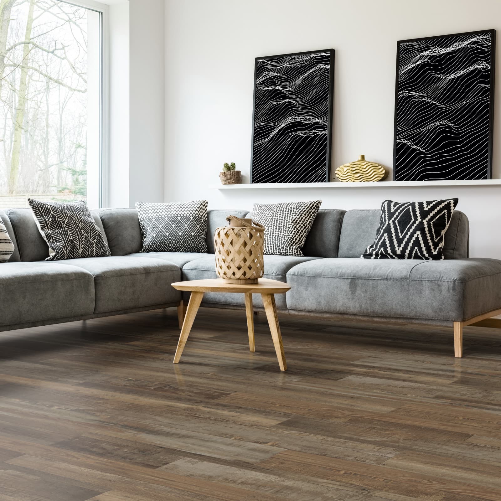 CALI Vinyl Select Redefined Pine - deep warm brown reclaimed-pine waterproof plank in a moody basement bedroom
