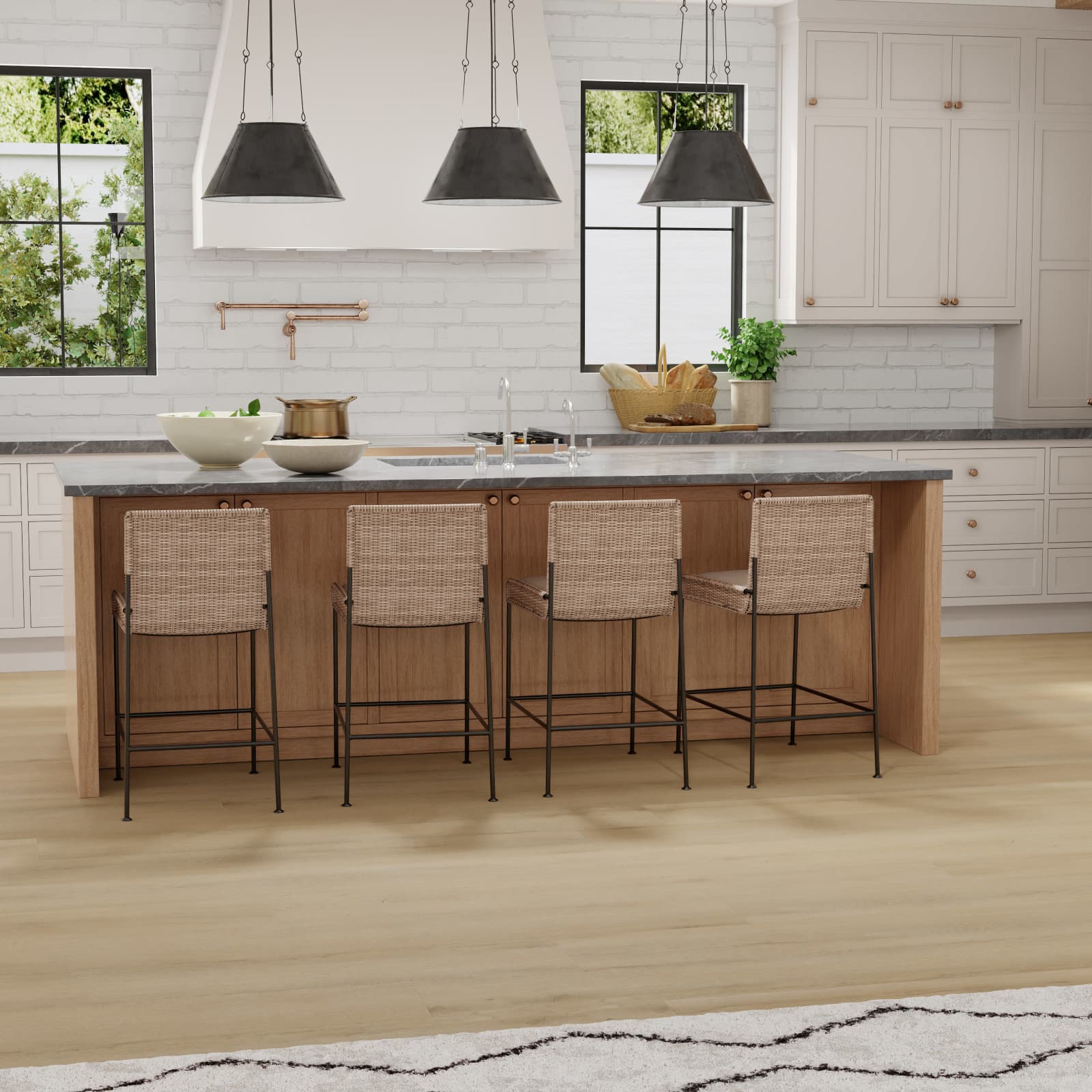 CALI Vinyl Select Turning Tide - sun-washed sandy tan waterproof vinyl plank in a bright coastal rental kitchen