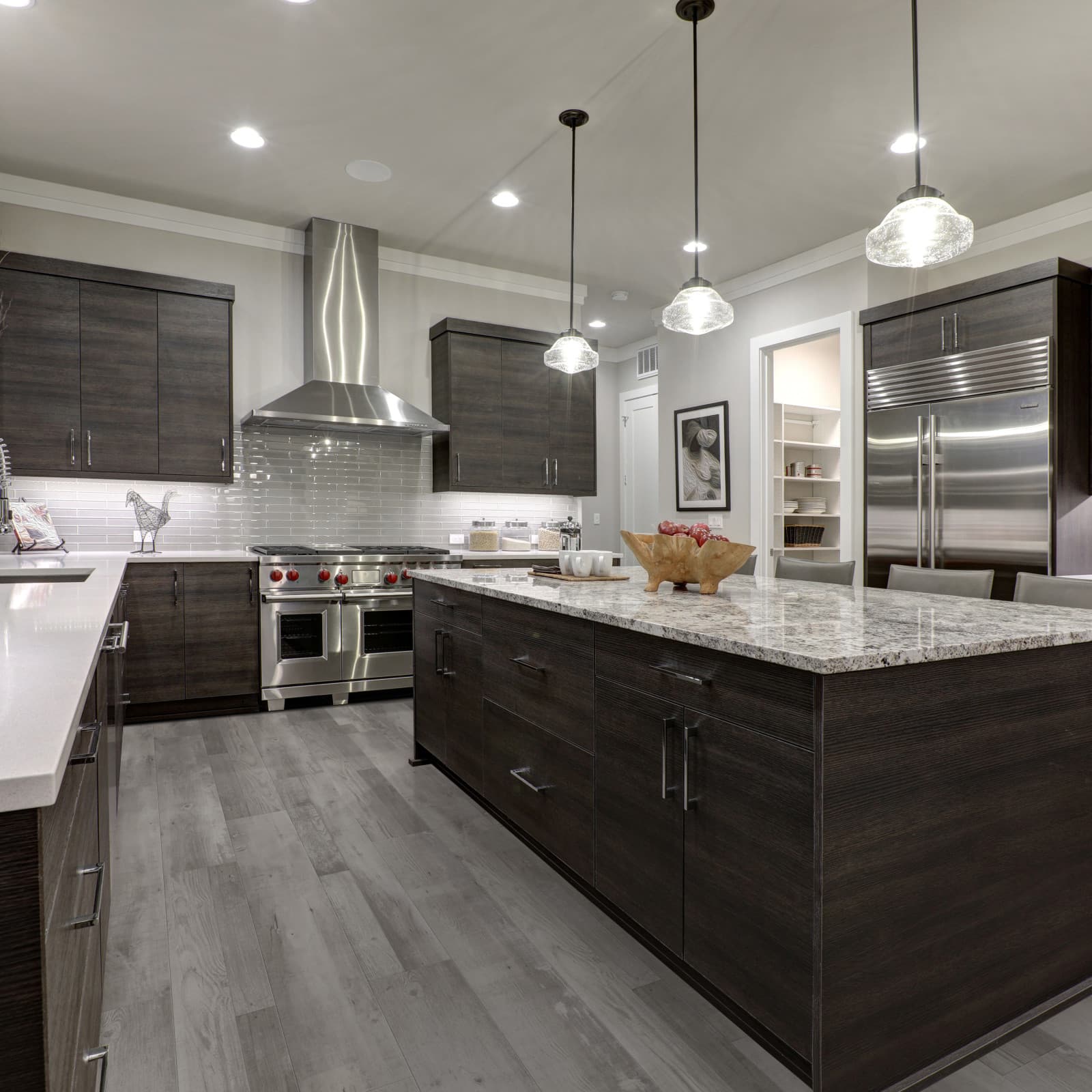 CALI Vinyl Select Premium Gray Ash - warm gray ash waterproof plank in a contemporary living room