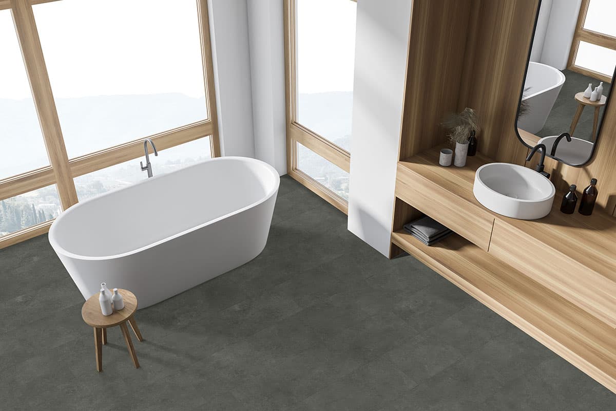 MSI Trecento Stormbound - deep dramatic gray stone-look luxury vinyl tile in a moody Italian-modern bathroom