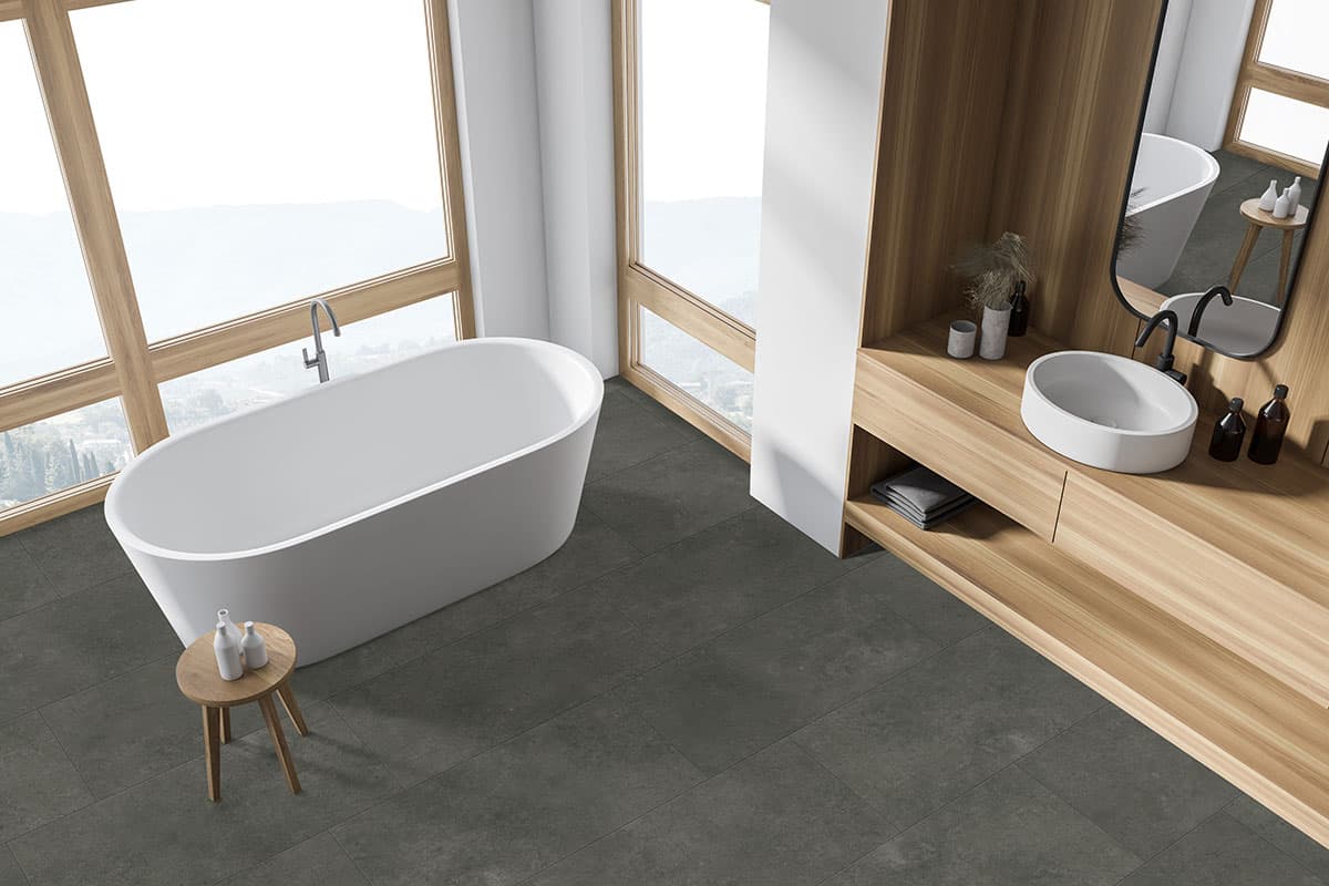 MSI XL Trecento Stormbound - deep storm-gray stone-look tile with cloudy tonal movement in a dramatic contemporary bathroom